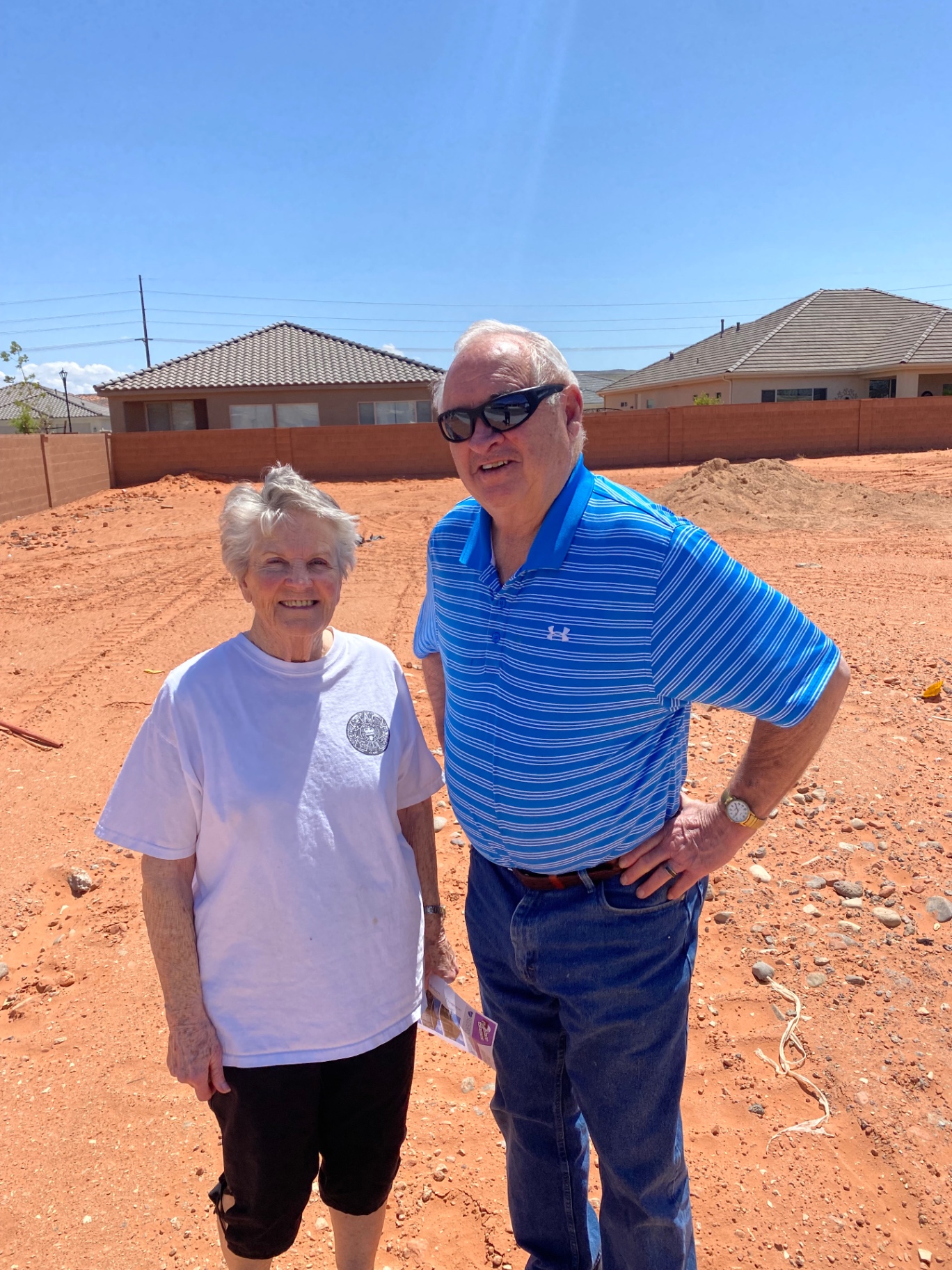 Couple standing on their new homesite in Southern Utah