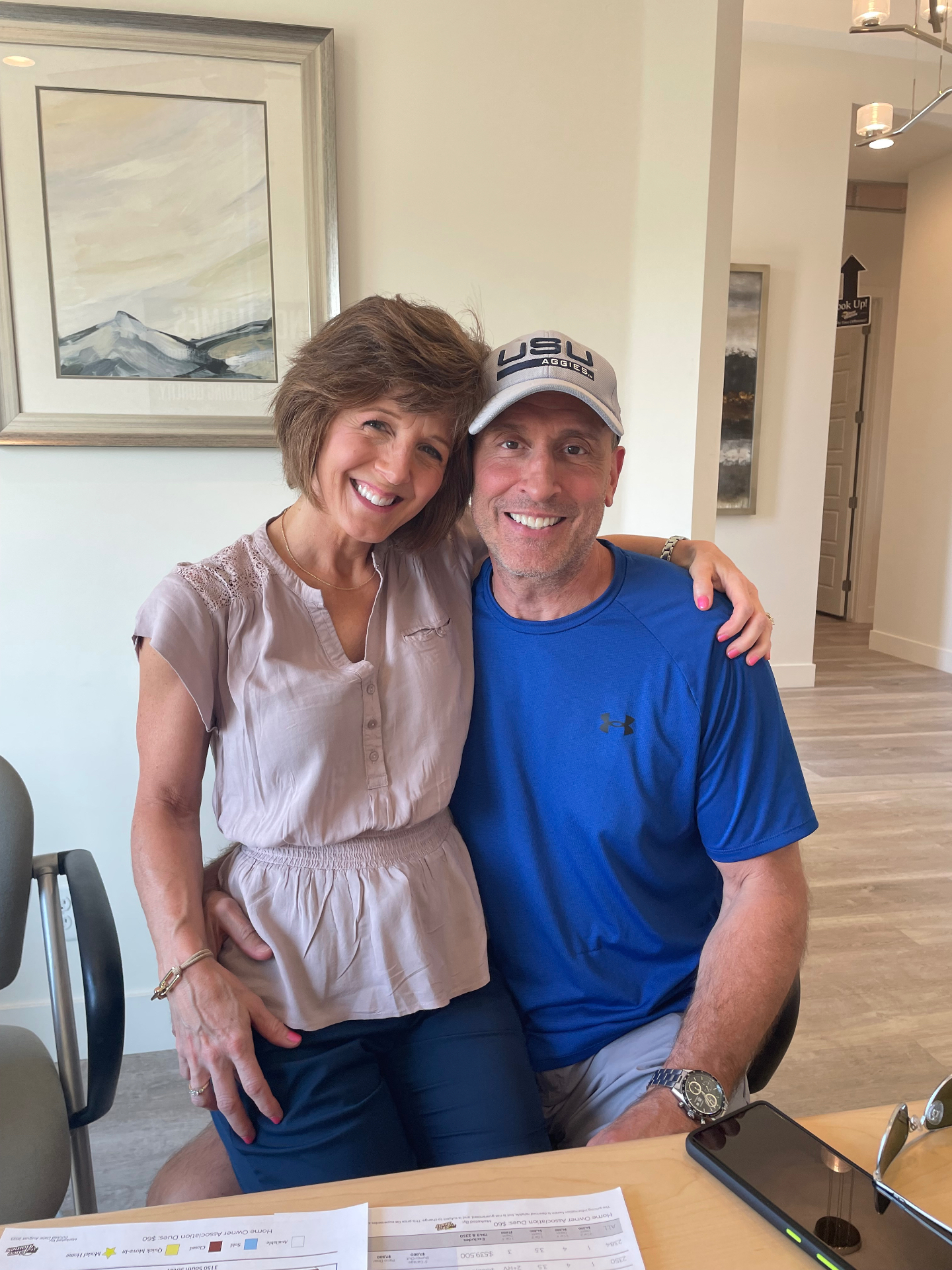 Happy couple signing at the builder's design center